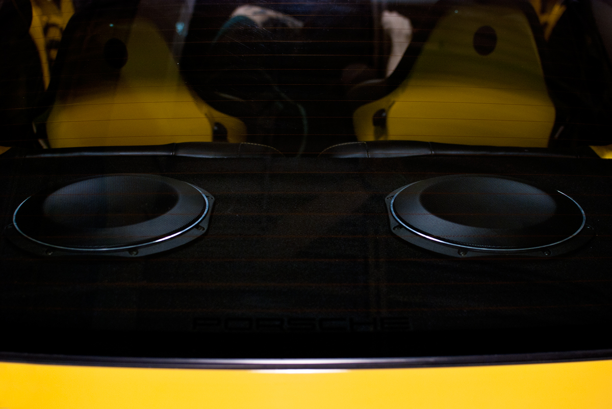 Two JL audio 10TW1 subwoofers installed behind rear seats