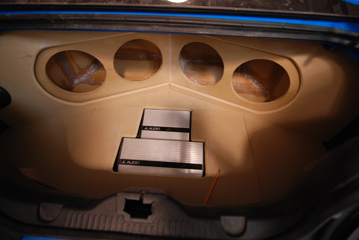 custom made enclosure to fit the awkward trunk floor.